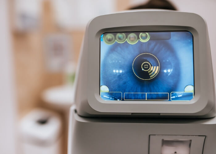 Optical machine with a close-up of an eye on the screen