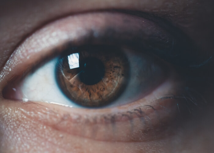 Close up of an eye with brown iris